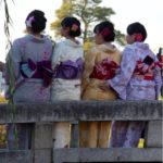 Geisha Girls sitting on bridge in Kurashiki