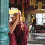 Monk praying in Yangong, Myanmar